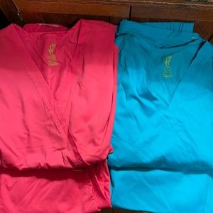 2 pairs of pink and teal ViVi brand scrubs XL tops and XL petite bottoms.